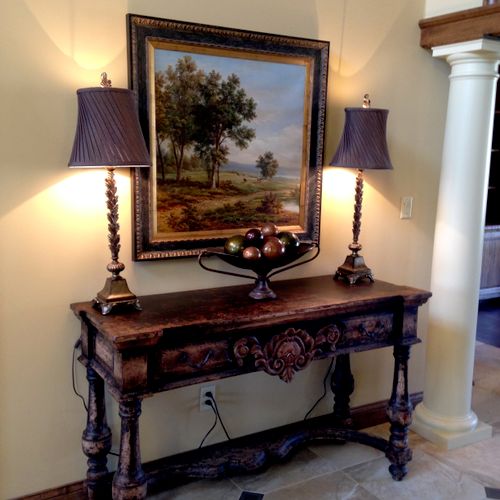 Entry way console table with painting, lamps and a