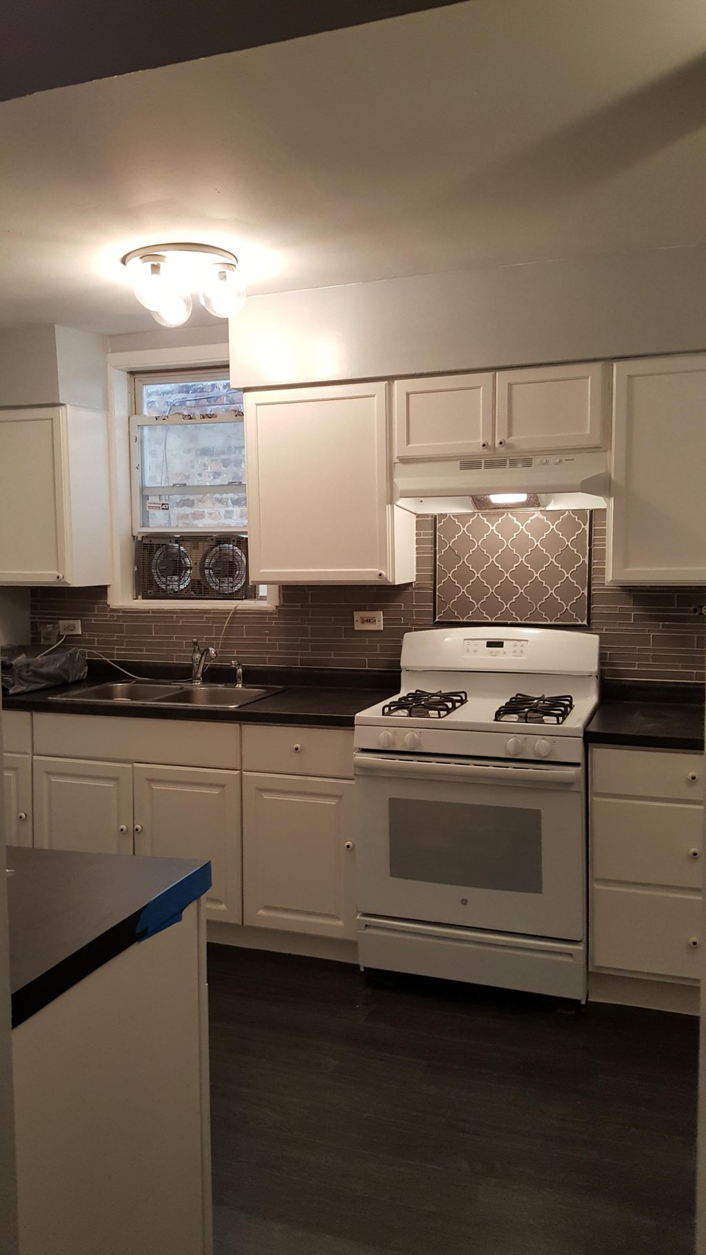the completion of a kitchen upgrade, back splash,f