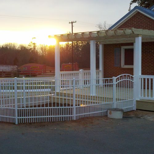 wood deck and pergola with pvc wrapped posts and a