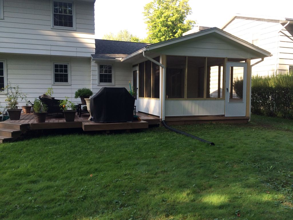 Open porch converted to an enclosed screen room in