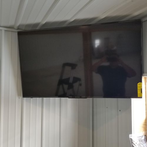 Mounted TV at indoor baseball practice