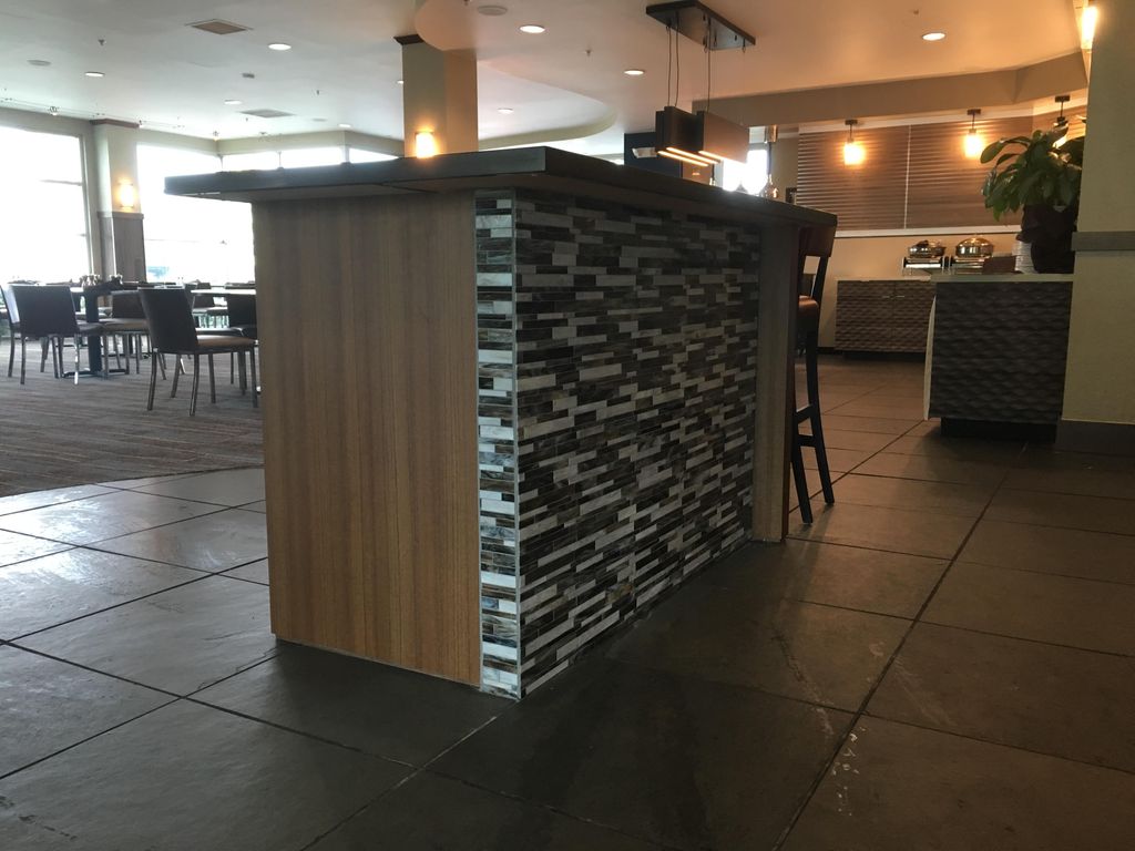 Custom hostess stand inside a restaurant.