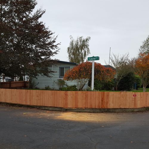 3 foot cedar fence wrapping a corner lot.