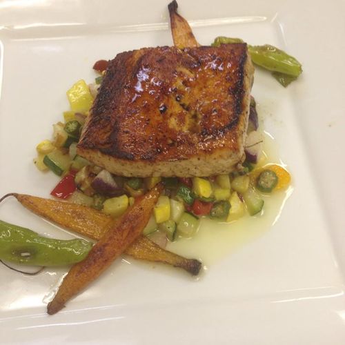 Seared salmon with a sauteed summer vegetable medl