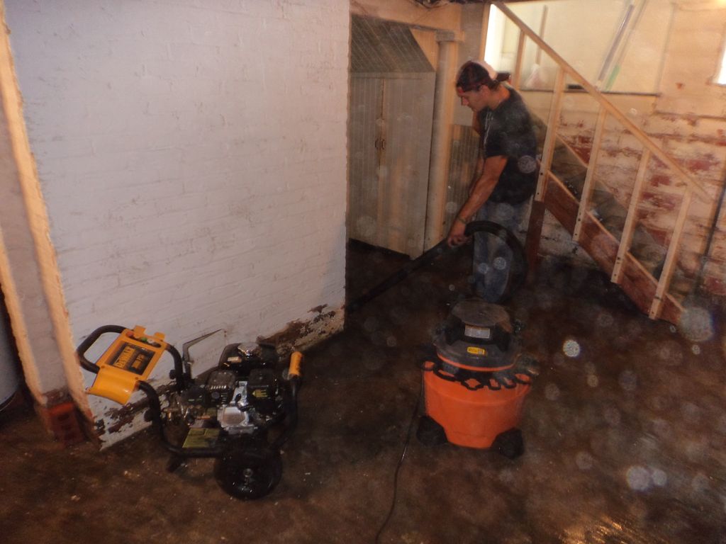 Pressure washing and cleaning an unfinished baseme