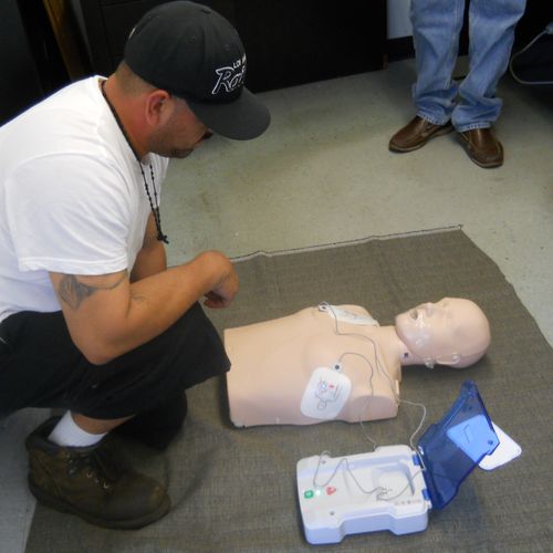 Employee waiting for AED's instructions after putt