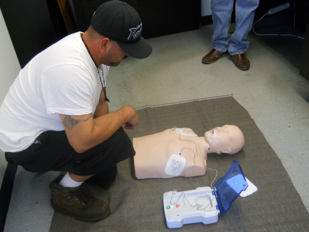 Employee waiting for AED's instructions after putt