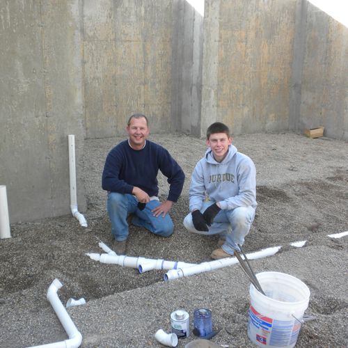Me and my son installing plumbing for a new home