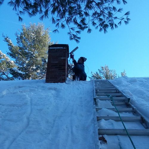 Installing a new chimney cap to keep critters out