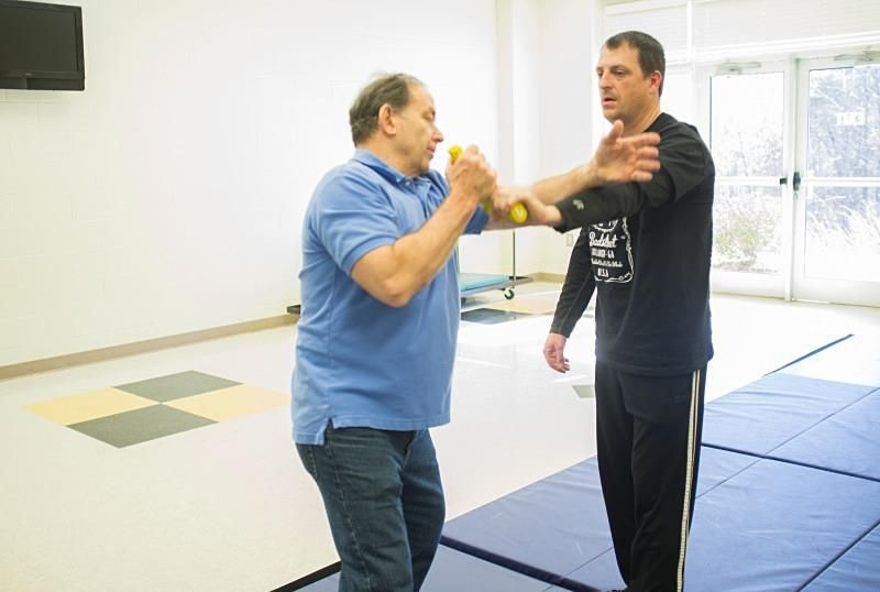 Showing a student how to disarm someone with a gun