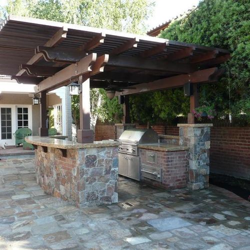 Outdoor kitchen with polyurethane panels or rock