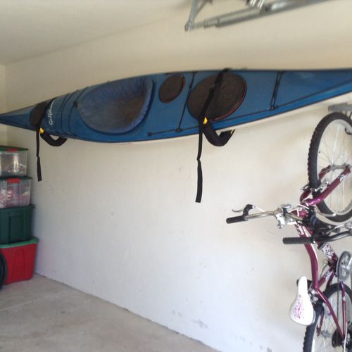 Installed Kayak & bicycle rack on interior concret