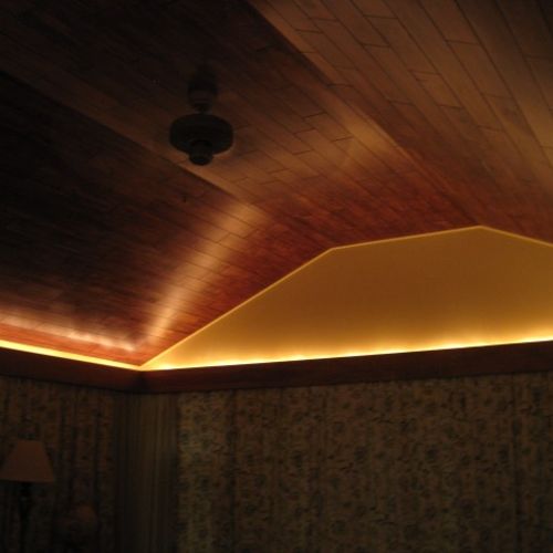 A hardwood ceiling accented with up-lighting.  The
