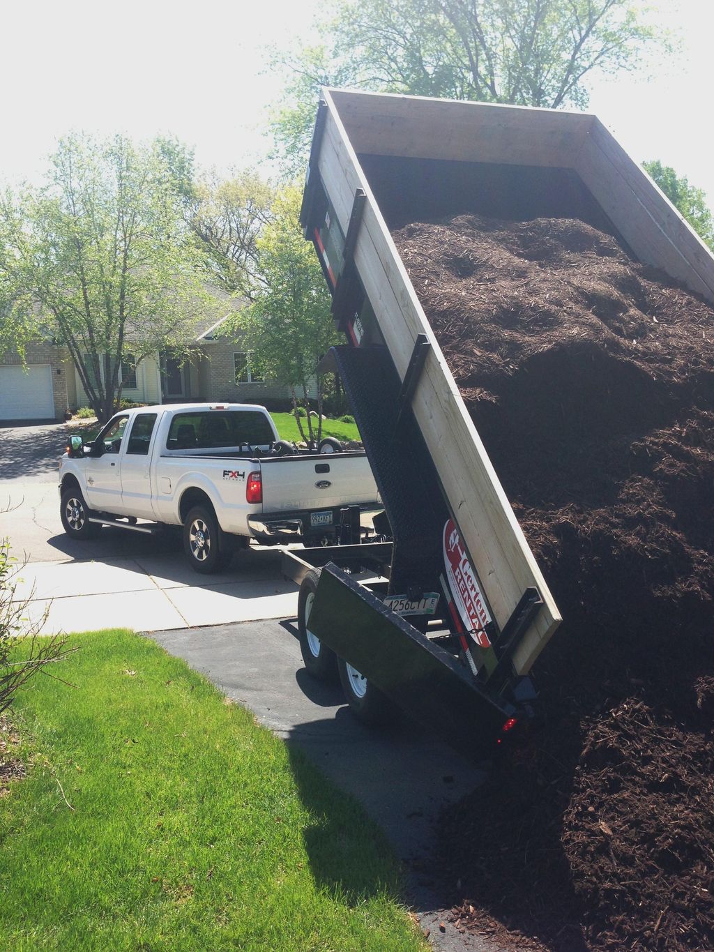 delivering large load of mulch to job site