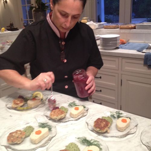 Last minute touches on a Kosher Passover Dinner.