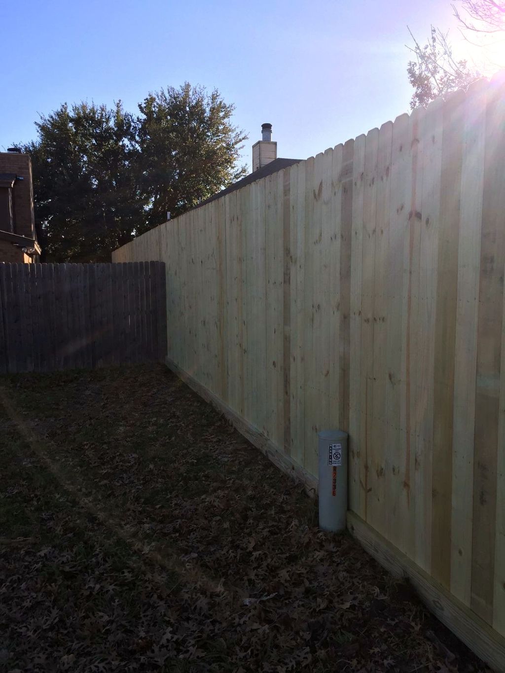 8' wood privacy fence with rot board in Bedford.