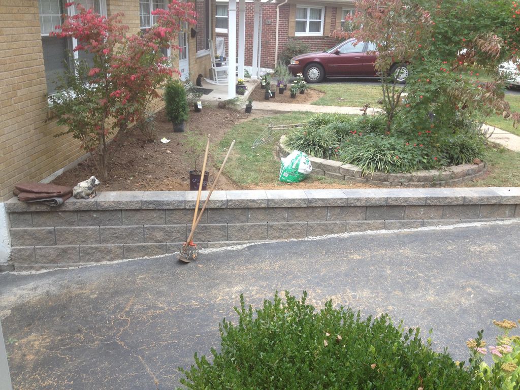 Manufactured brick style retaining wall along a dr