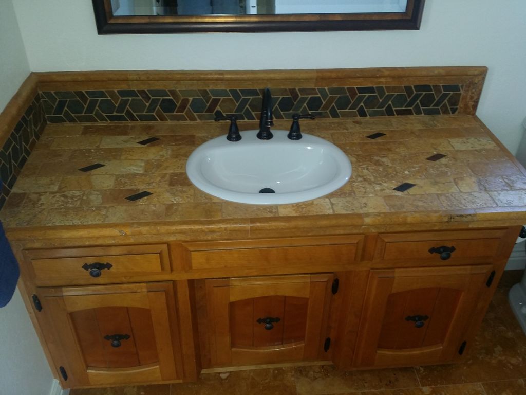 Custom Travertine tile vanity top with medallions 