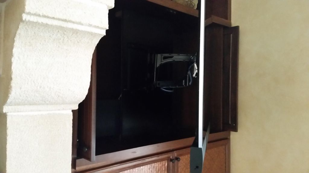 65" tv on articulating arm in deep cabinet