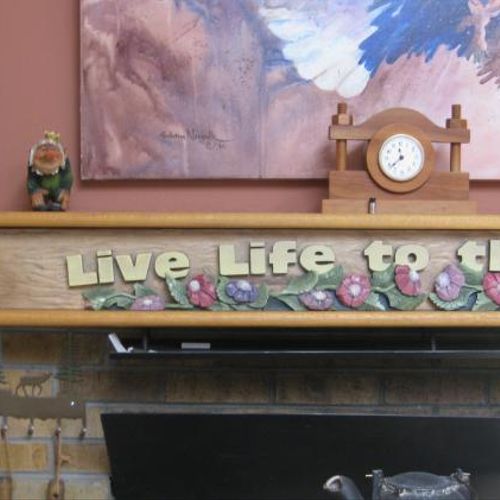 Fireplace mantle routed and hand-carved. this is j