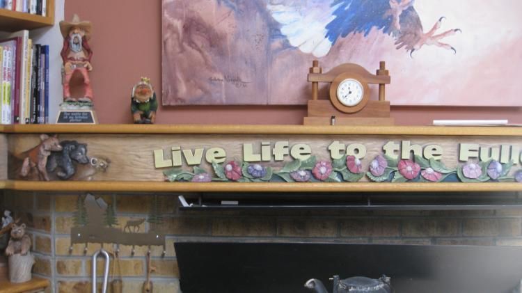 Fireplace mantle routed and hand-carved. this is j