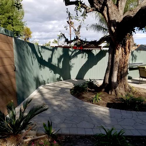 painted privacy fence with 2 gates