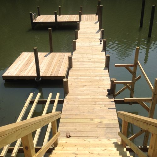A brand new dock with a floating dock, kayak racks