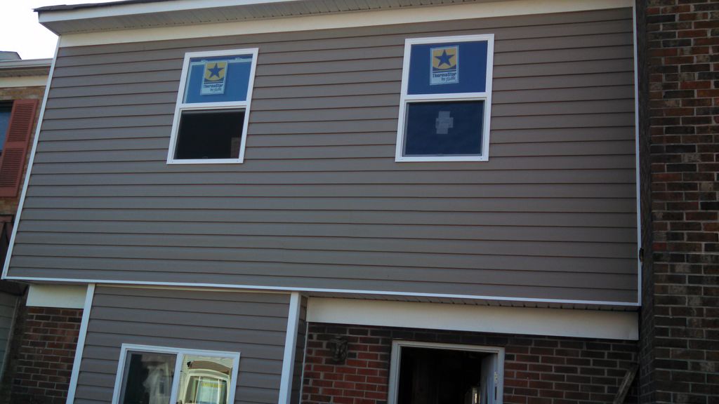 New windows,siding,metal wrap and gutters