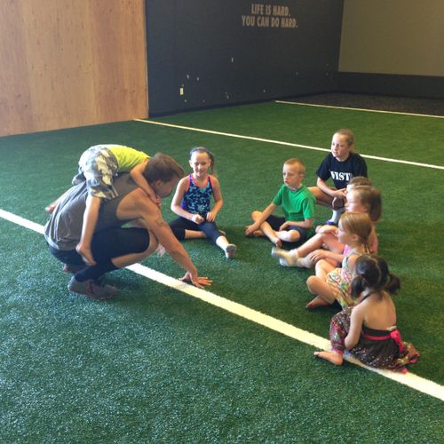 Coach Daniel working with ProjectMOVE Kids. Fitnes