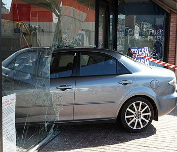 Glass storefront car crash. Glass repair and frame