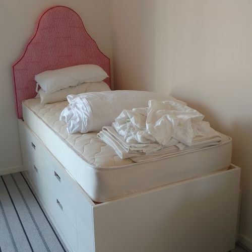 Bed with upholstered headboard and storage