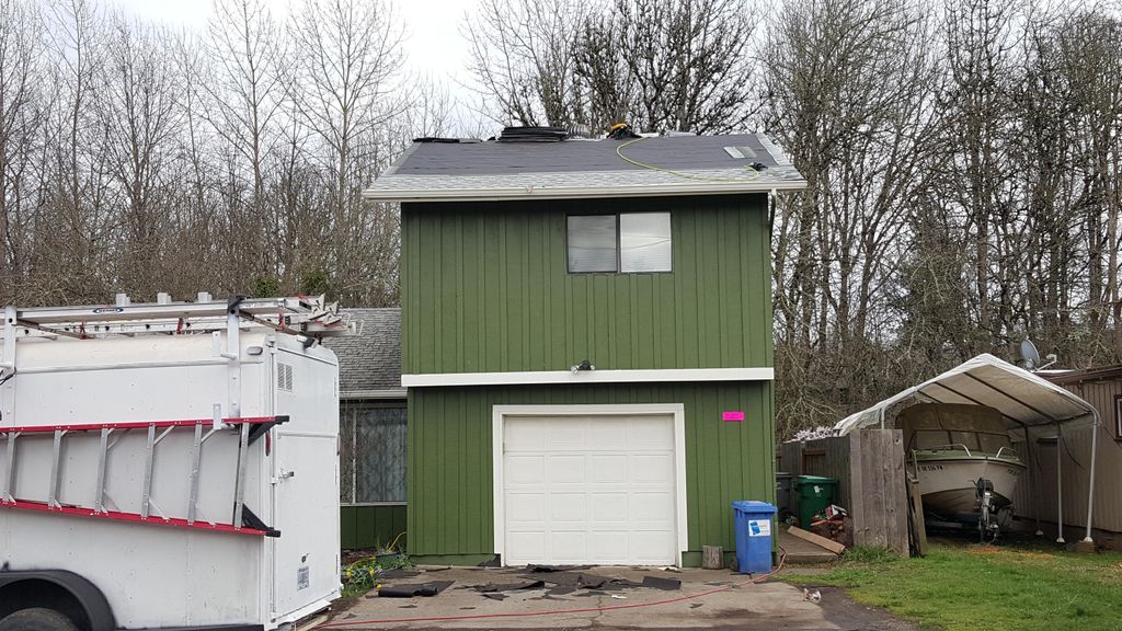 Fallen tree damage repair. new roof, eave, all rep