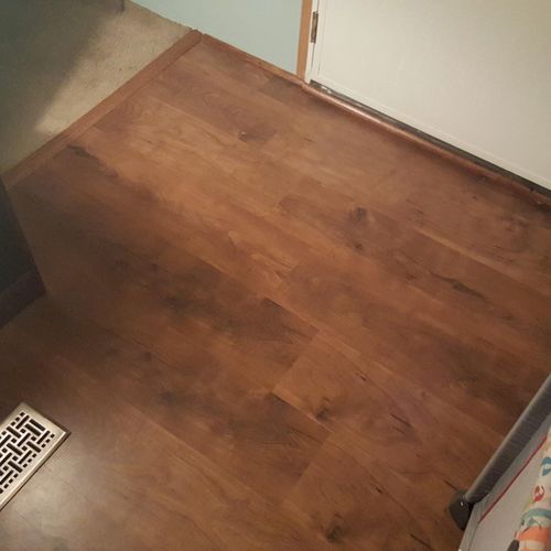 330 spft. laminate job in a living room, t-mold an