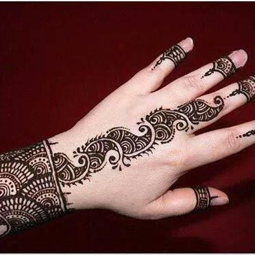 Henna is traditionally applied to the hands and fe