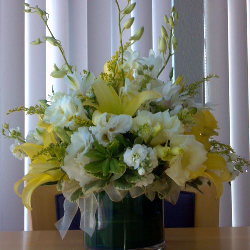 Yellow and White Lily and Orchid centerpiece.