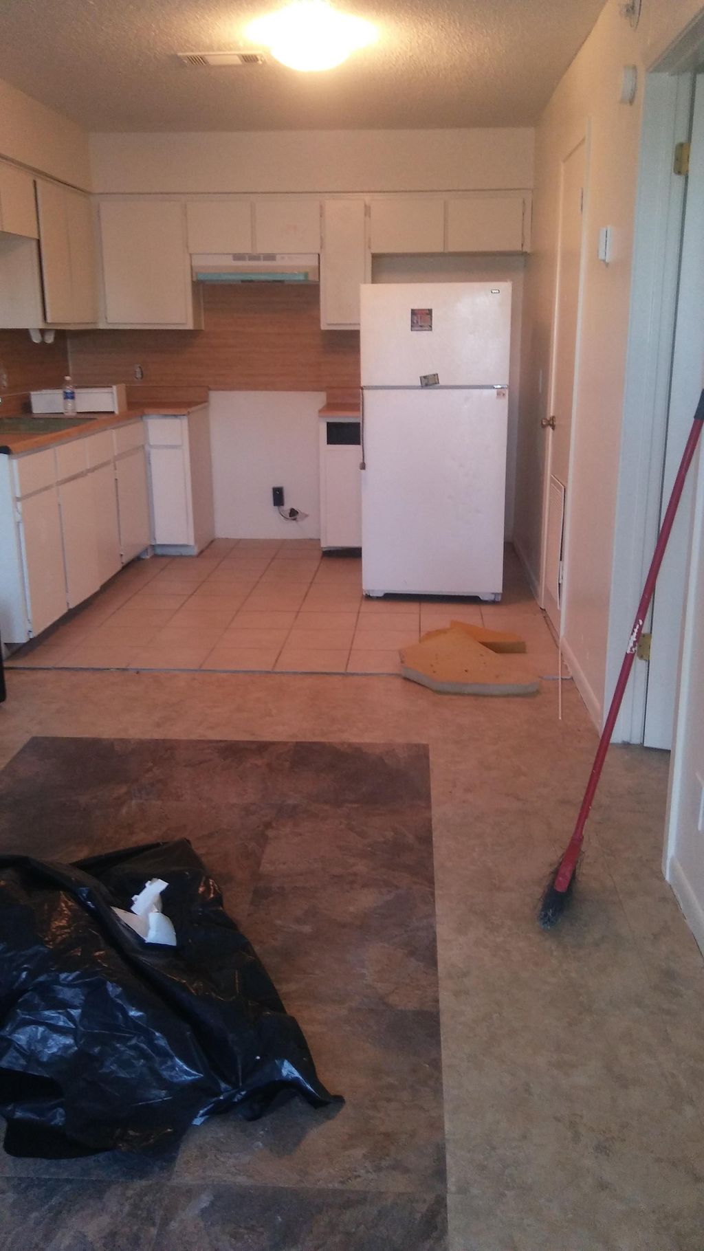 cleaning,  stick tile , patch, and paint completed