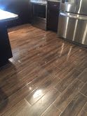 Wood tile installed in kitchen and living area