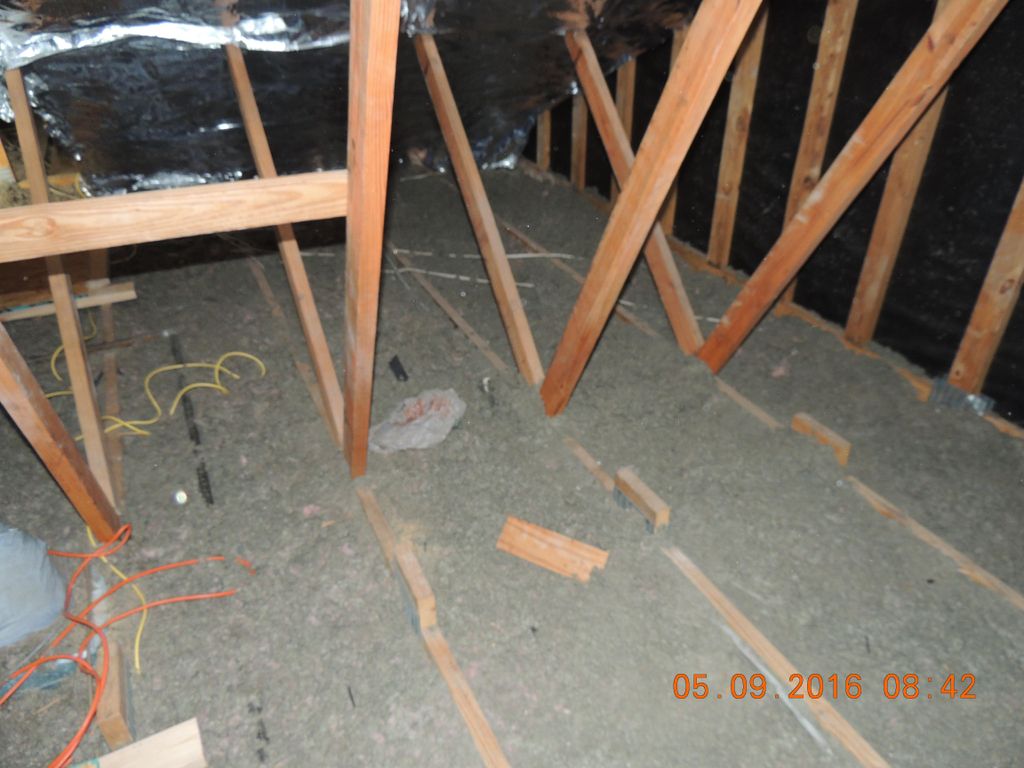 Old and flat attic insulation.