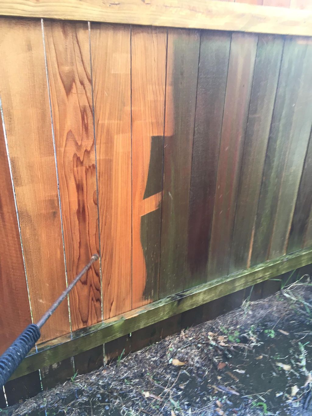 Washing of wood fence.  