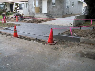 New concrete curb & gutter, new driveway approach 