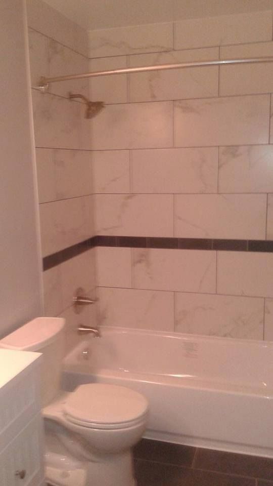 New tiles, toilet, and vanity/ sink.