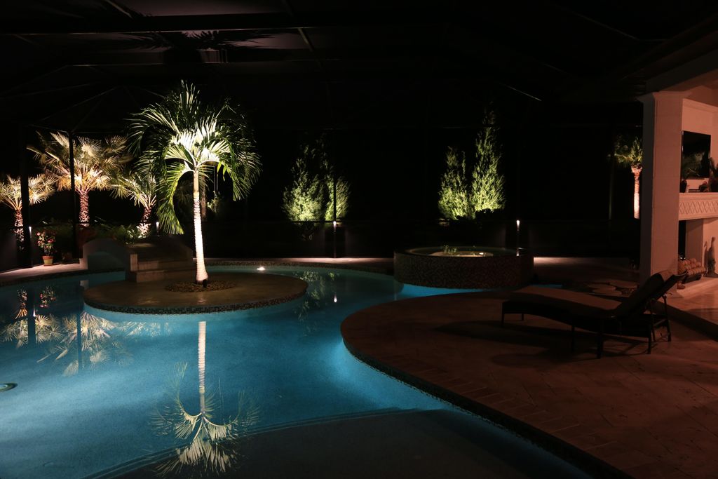 Outdoor living area, featuring pool cage accent li