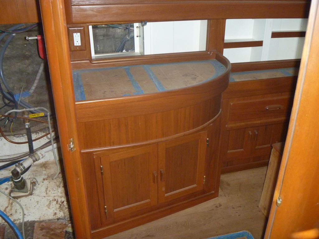 Curved front vanity with marble counter and sink