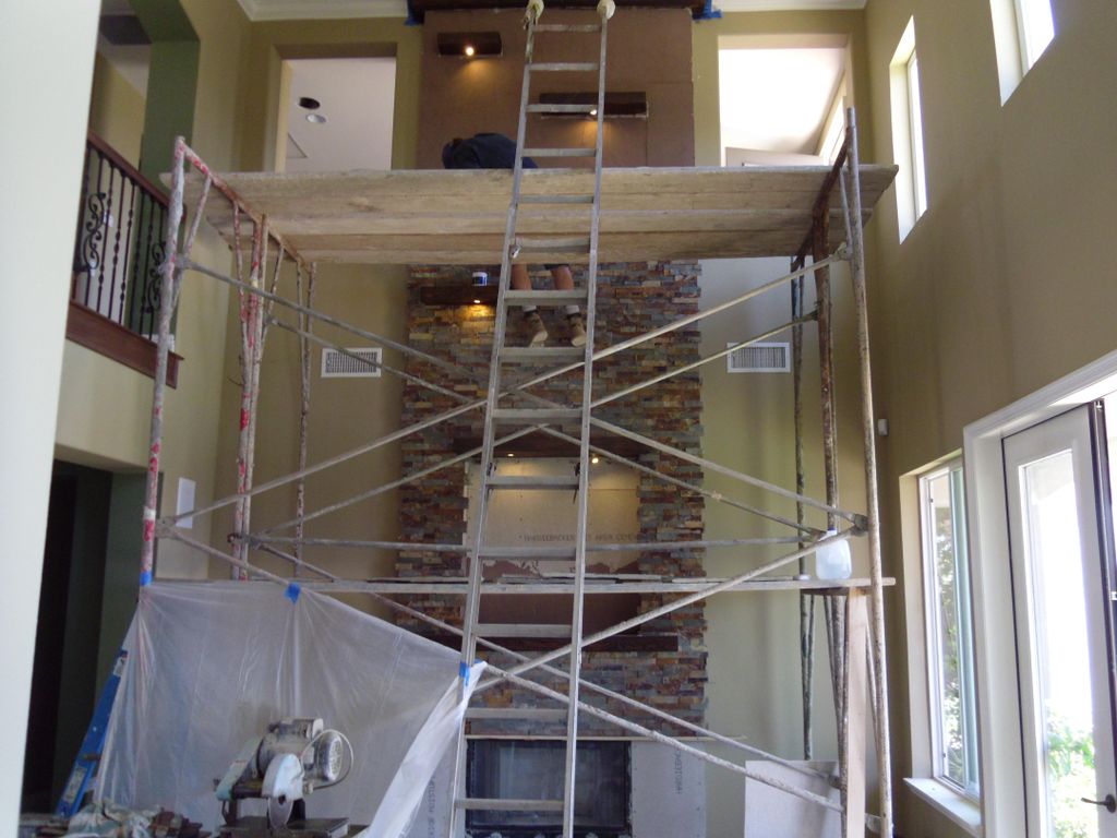 Stone fireplace with ledges and lighting