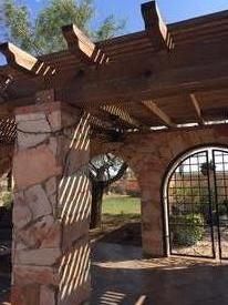Wood arbor crafted by hand and erected on south Te