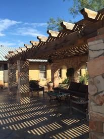 Wood arbor crafted by hand and erected on south Te