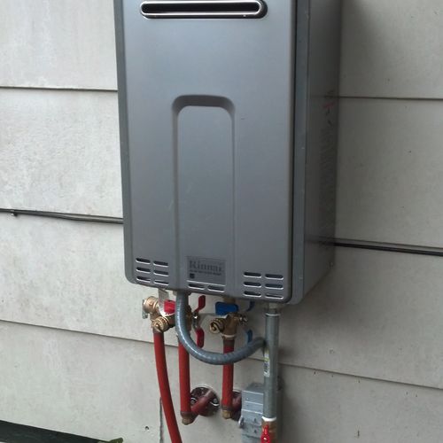 Tankless gas water heater.