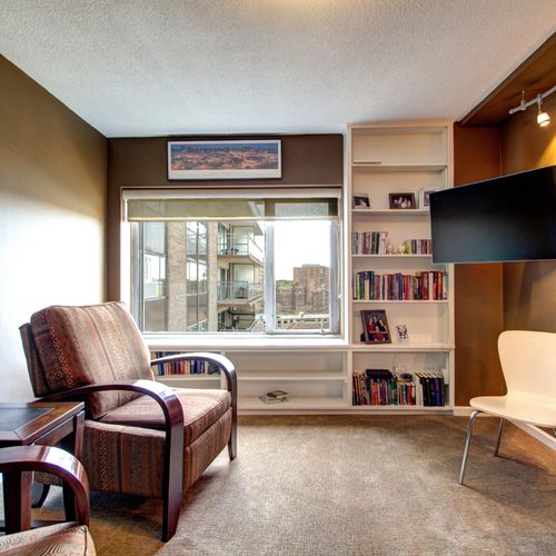 A den/television space designed for simple and lig
