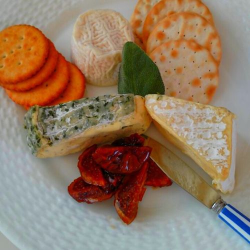 Artisan cheeses with glazed figs and crackers