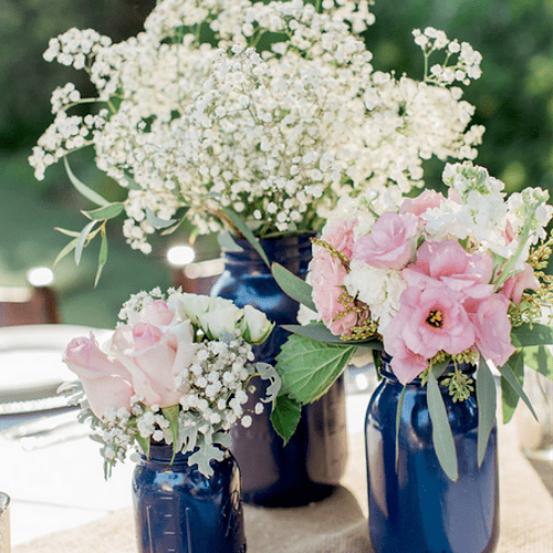 The centerpiece with mason jars and silver mercury